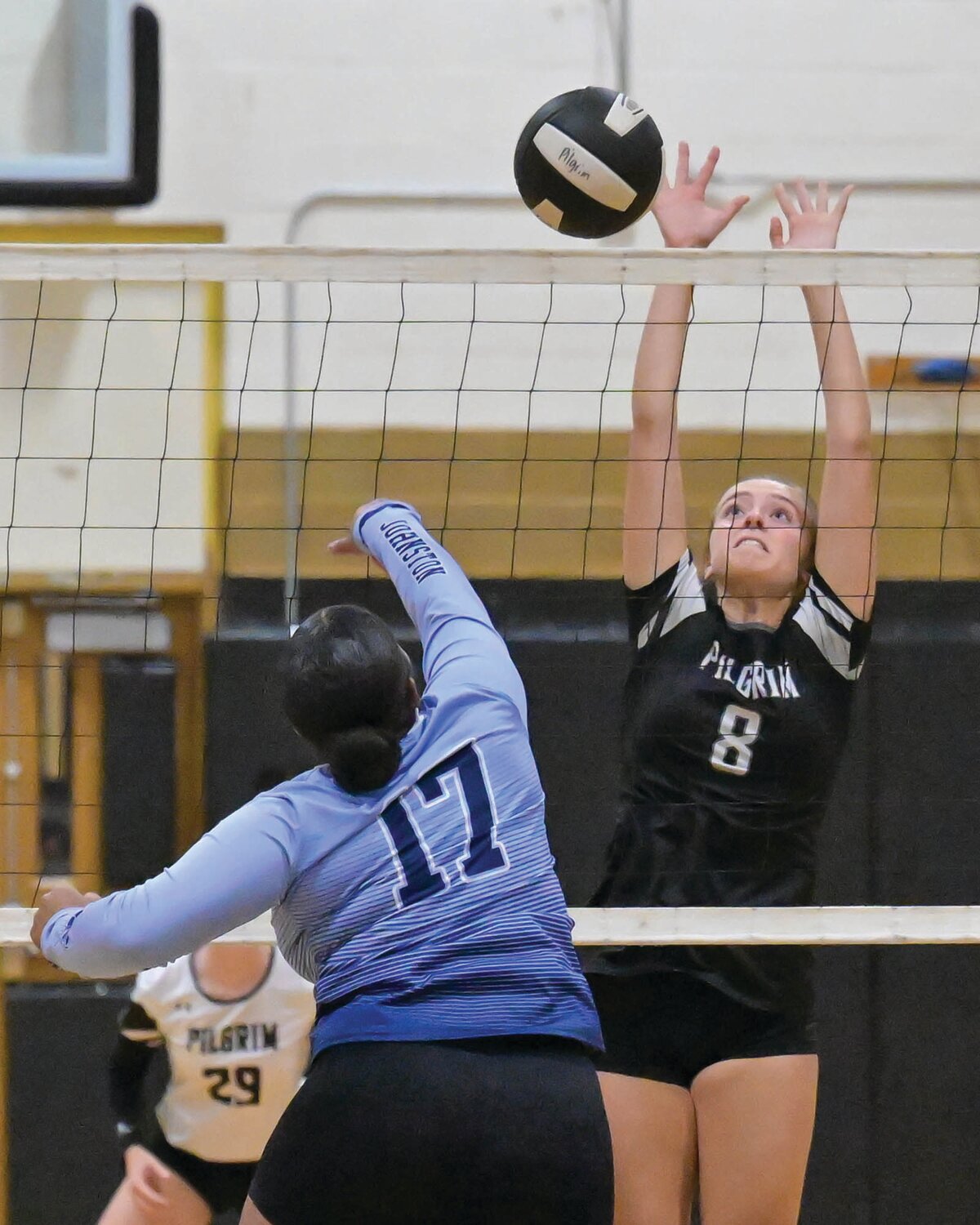 AT THE NET: Pilgrim’s Avery
Adams leaps to block a
shot in a match this fall.